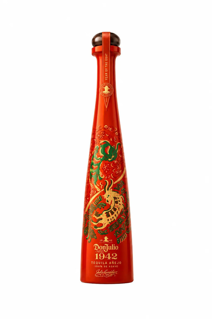 Tequila anejo bottle with red glass and ornate green-gold goat label