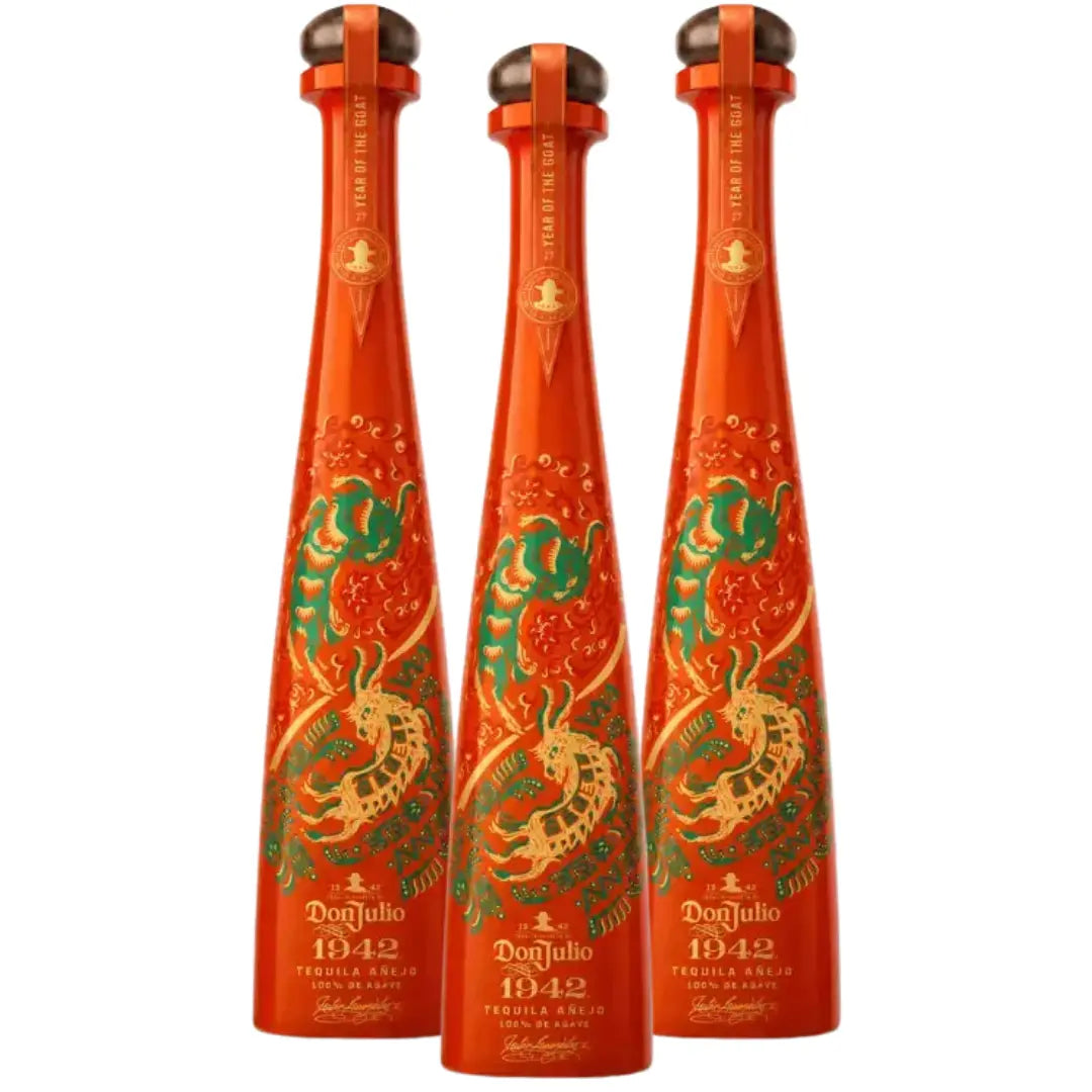 Set of three tequila anejo bottles with red glass and green-gold goat labels