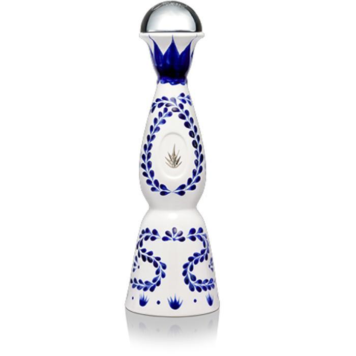 Clase Azul reposado tequila bottle, blue-and-white ceramic with leaf emblem and metal cap