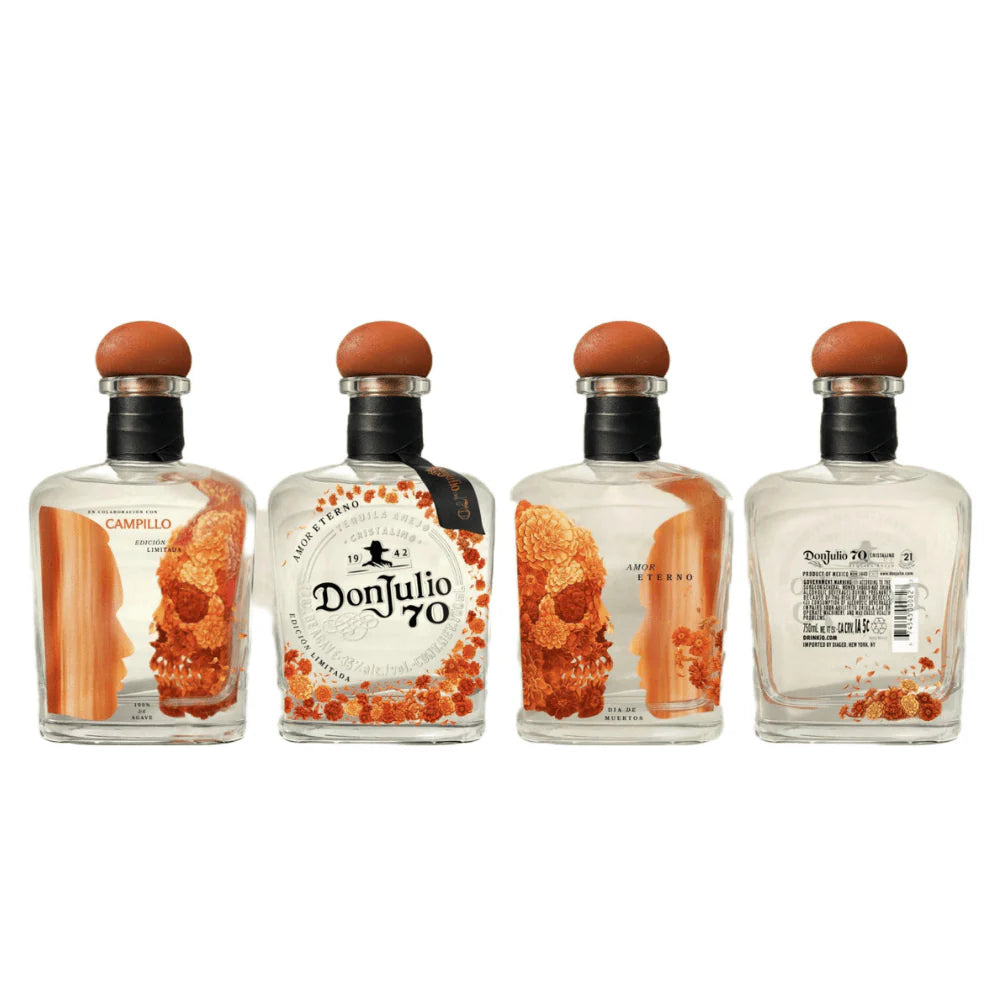 Four Don Julio 70 tequila bottles with orange toppers and orange floral accents