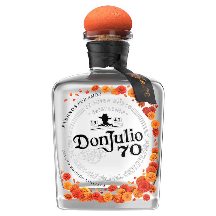 Don Julio 70 tequila bottle with orange topper, black neck wrap, and orange flower label