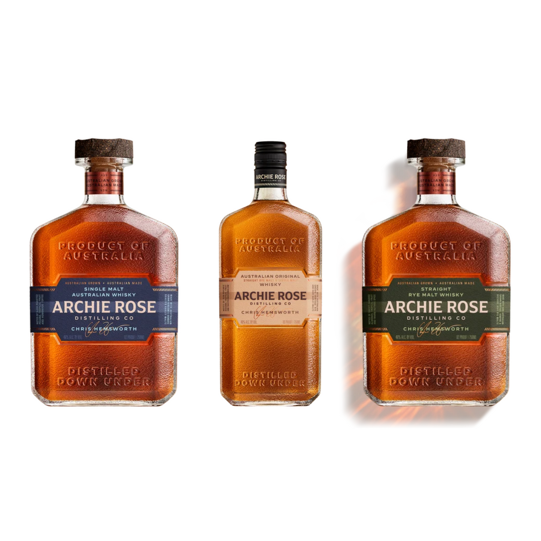 Archie Rose whisky bottle trio in amber glass with labeled neck and caps