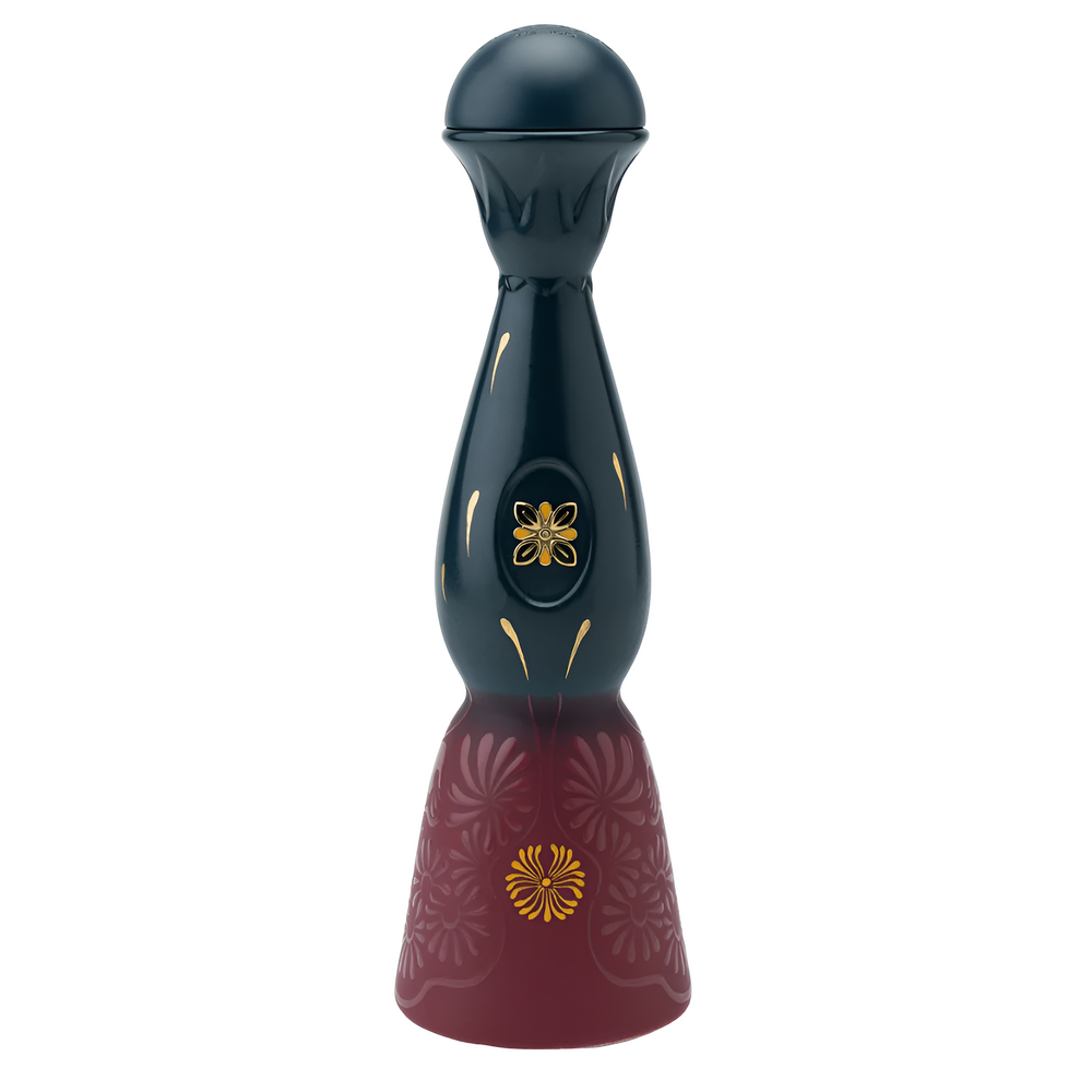 Dark blue and burgundy tequila bottle with gold flower emblem and curved accents