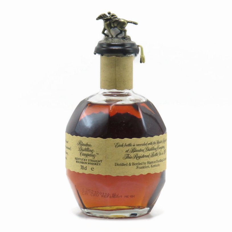 Blanton's single barrel bourbon bottle showing back label and amber liquid.