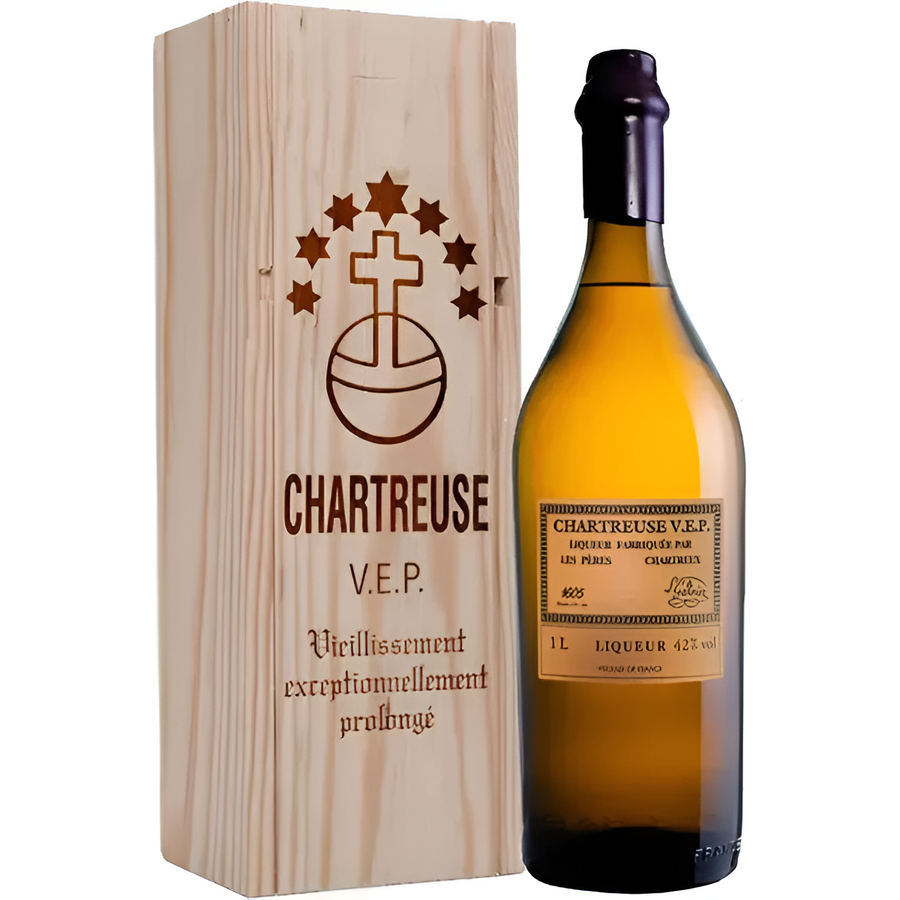Yellow liqueur bottle with dark glass and Chartreuse V.E.P. label, in wooden box