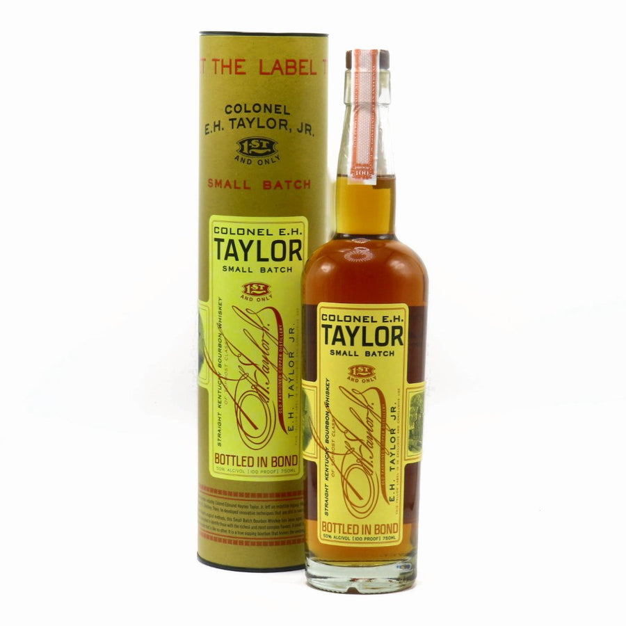 Small-batch bourbon whiskey bottle with front label, gold cap, with matching carton