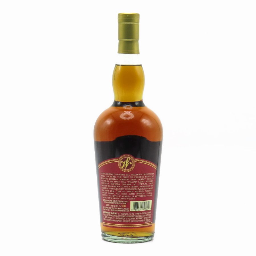 Bourbon whiskey bottle with gold cap, back label facing camera