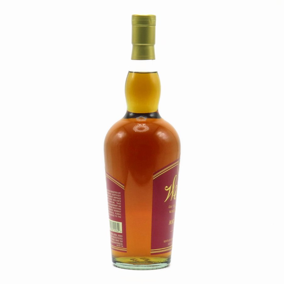 Bourbon whiskey bottle with gold cap, side label panel visible