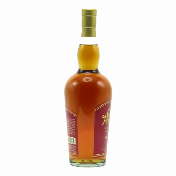 Bourbon whiskey bottle with gold cap, side label panel visible